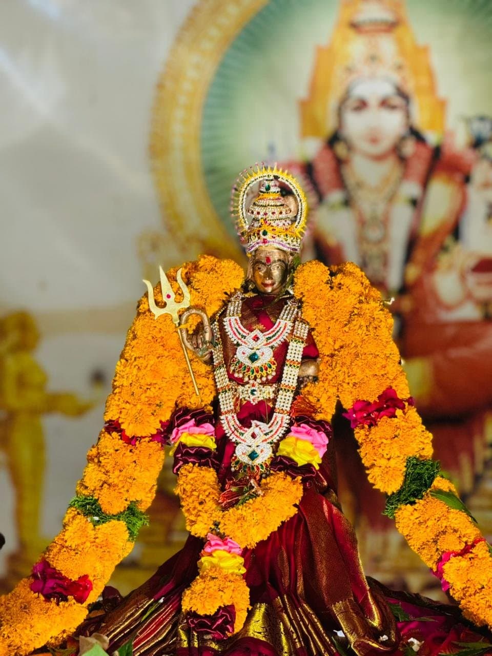 Sri Kannagi Amman deity adorned with marigold garlands