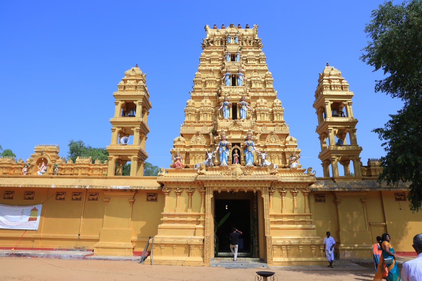 Front view of Arasarpathi Kannagi Amman Potkovil with twin bell towers and central gopuram
